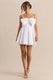 ECM_HR_CL137438110---Elina---White-Square-Neck-Mini-Dress-With-Bow-Detail-1.jpg