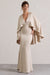 Yasie | Robe longue champagne en satin avec décolleté plongeant et manches cape