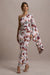 Clementina | Robe longue asymetrique à imprimé floral crème avec manches en cape