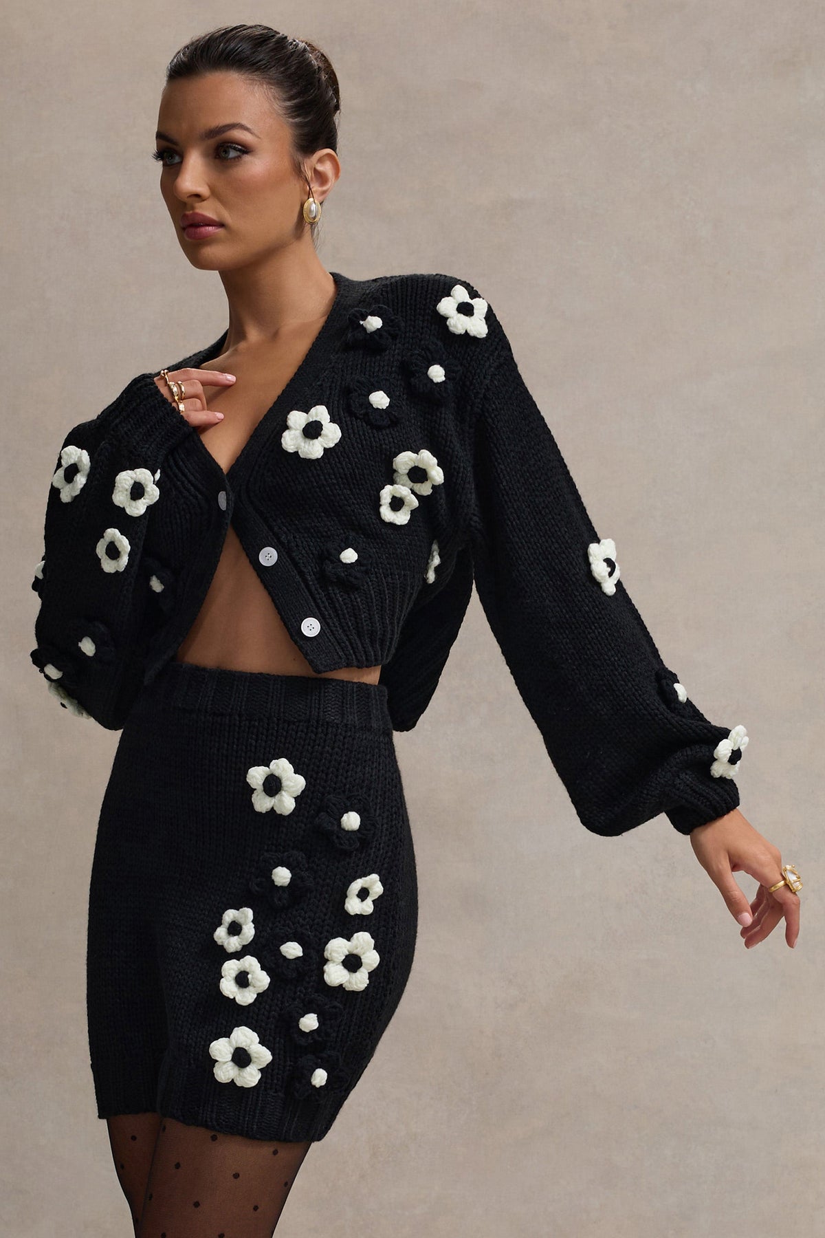 Triomphe | Mini-jupe en maille noire et blanche à motifs floraux