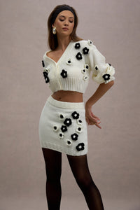 Triomphe | Mini-jupe en maille crème à motifs floraux